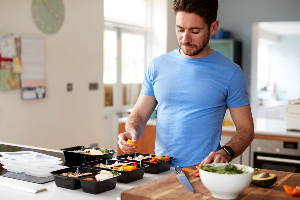 Man meal-prepping with healthy foods